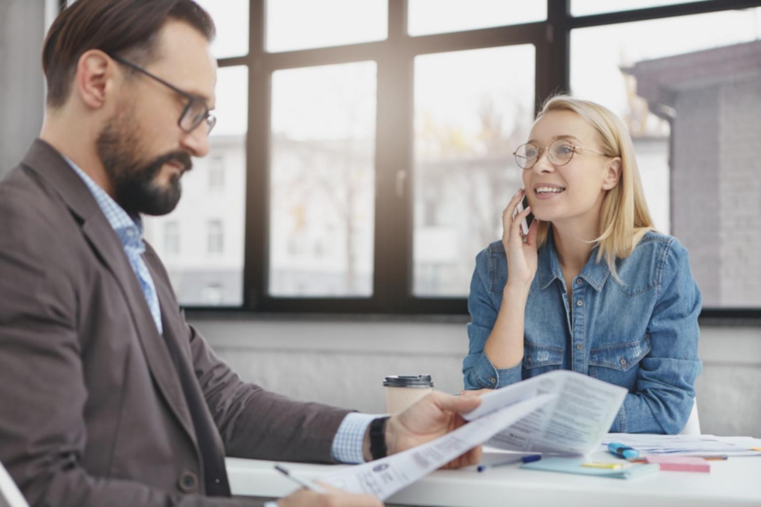 Investment professionals networking and discussing market opportunities at research conference